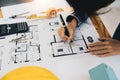 architect working in office with blueprints. Engineer inspect architectural plan, sketching a construction project Royalty Free Stock Photo