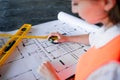 Architect working over plan. Closeup Desk With blueprints drawing. Royalty Free Stock Photo