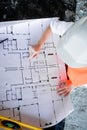 Architect working over plan. Closeup Desk With blueprints drawing