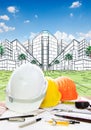 Architect working table with writiing tool safety helmet and pe Royalty Free Stock Photo