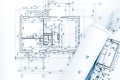 Architect workplace with project plans and rolled blueprints Royalty Free Stock Photo