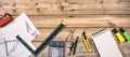 Architect workplace. Project construction blueprints and engineering tools on wooden desk, copy space