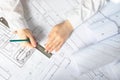 The architect works on architectural blueprints, construction plans in the office Royalty Free Stock Photo