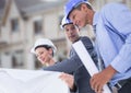 Architects with blueprints on building site Royalty Free Stock Photo