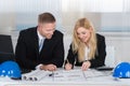 Architects Discussing Over Blueprint In Office Royalty Free Stock Photo