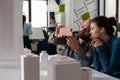 Architects doing teamwork looking at mobile content on smartphone Royalty Free Stock Photo