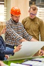 Architects and engineers working with blueprints and architectural plan Royalty Free Stock Photo