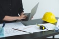 Architects or engineers working construction and drawing construction plans, printing, writing on-site construction sites. Home Royalty Free Stock Photo