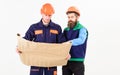 Architects in hard hat on busy faces looks at drawing Royalty Free Stock Photo