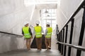 architects in helmets walking downstairs at office Royalty Free Stock Photo