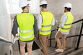 architects in helmets walking downstairs at office Royalty Free Stock Photo