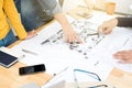 Architects or landscape designers discussing blueprints Royalty Free Stock Photo