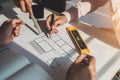 Architects meeting about construction project of house with blueprints in office. Construction and structure concept Royalty Free Stock Photo