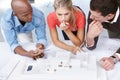 At the architects table...A group of architects working together on an architectural model. Royalty Free Stock Photo