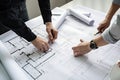 Architects working on blueprint at office desk, architectural concept. Engineering and technician drawings and designs on table, Royalty Free Stock Photo