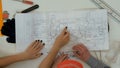 Architects working on blueprints with divider compass Royalty Free Stock Photo