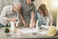 Architects working on plans, light effect Royalty Free Stock Photo