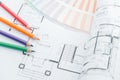 Architects workplace - architectural drawings of the modern house with color pencils and sample colors. decoration concept. Royalty Free Stock Photo