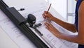 Architectural artistry. a female architect working at a drawing board. Royalty Free Stock Photo