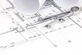 Architectural blueprint plans with rolls and drawing compass Royalty Free Stock Photo