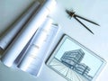 Architectural Blueprint on Tablet with Rolled Plans and Compass Royalty Free Stock Photo