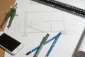 Architectural blueprints and blueprint rolls and a drawing instruments Royalty Free Stock Photo