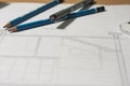 Architectural blueprints and blueprint rolls and a drawing instruments Royalty Free Stock Photo