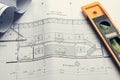 Architectural blueprints and blueprint rolls and a drawing instruments on the worktable Royalty Free Stock Photo