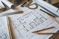 Architectural blueprints with design tools scattered around Royalty Free Stock Photo