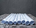 Architectural blueprints on grey wall backround Royalty Free Stock Photo