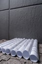 Architectural blueprints on grey wall backround Royalty Free Stock Photo