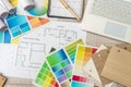 Architectural blueprints with paper and wooden color sampler on creative desk Royalty Free Stock Photo
