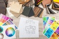Architectural blueprints with paper and wooden color sampler on creative desk Royalty Free Stock Photo