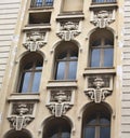 Architectural building with three diagonal rows of windows on different levels