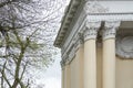 Architectural columns with figures and white stucco wealth. Royalty Free Stock Photo