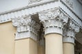 Architectural columns with figures and white stucco wealth. Royalty Free Stock Photo