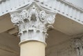 Architectural columns with figures and white stucco wealth. Royalty Free Stock Photo