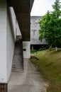 Concrete Staircase and Elevated Walkway beside Modernist Building on Grassed Slope Royalty Free Stock Photo