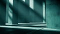 Architectural concrete columns casting long shadows in a teal-toned minimalist space Royalty Free Stock Photo