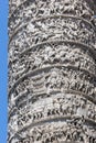 Architectural detail from ancient Marcus Aurelius Column in front of Palazzo Chigi in city of Rome, Italy Royalty Free Stock Photo