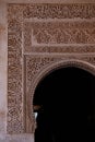 Architectural detail of the arched entrance of Alhambra palace in Granada, Spain