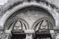 Architectural detail on a building in Chartres France showing stylized characters