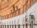 Architectural detail of front facade of Siena Town Hall, Palazzo Pubblico, at the Piazza del Campo, Tuscany, Italy