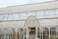 Architectural detail of iron and glass greenhouse structure in Florence, Italy