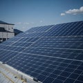 Architectural Detail of Metal Roofing on Commercial Construction Solar panels or Solar cells Over Factory, Blue Sky With Sun Rays Royalty Free Stock Photo