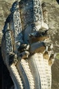 Architectural detail of the Naga mythological Giant snake at the ancient Wat Chedi Luang temple in Chiang Mai, Thailand.