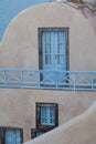 Architectural detail of Oia, Santorini, Greece. Blue wooden door and shutters Royalty Free Stock Photo