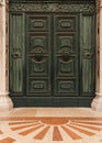 Architectural detail of an old green door in Venice, Italy Royalty Free Stock Photo