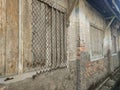 Architectural detail of old warehouse window and wall Royalty Free Stock Photo