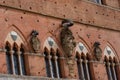 Architectural detail of the Palazzo Pubblico at the Piazza del Campo in Siena, Italy, Europe Royalty Free Stock Photo